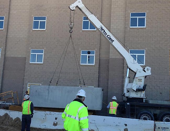 A 2,000 gallon greywater surge tank going into one of six new barracks at USMC Base 29 Palms in 2013.